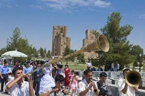 Wedding ceremony in Shakrisabz in the background the Ak Saray Palace, Uzbekistan Wedding ceremony in Shakrisabz in the background the Ak Saray Palace, Uzbekistan