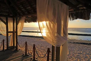 Love Prints: Wedding gazebo at sunset with view of beach at Point aux Piments in Mauritius