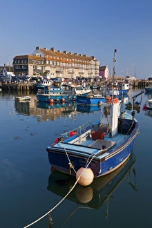 West Bay harbour with yachts and fishing boats, Bridport, gateway town for the Jurassic Coast, UNESCO World Heritage Site, Dorset, England, United Kingdom, Europe