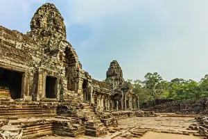 Anthropomorphic Face Prints: West inner gallery towers and four of the 216 carved faces at Bayon temple in Angkor