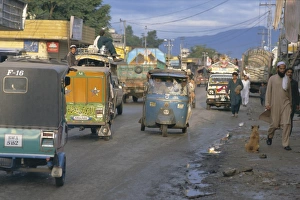 Cosmopolitan Prints: Three wheeled vehicles on main road