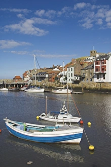 Whitby Prints: Whitby church and fishing boats in the harbour, Whitby, North Yorkshire