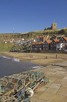Lobster Pot Prints: Whitby church, sandy beach and lobster pots on quayside, Whitby, North Yorkshire