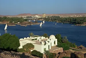 Aswan Prints: White Begum residence overlooking the River Nile with feluccas, at Aswan