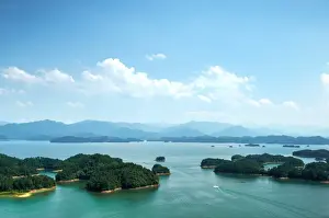 A white boat making its way across Qiandao (Thousand Islands) Lake, Chunan, Zhejiang