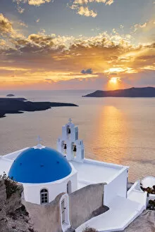 Santorini Gallery: A white church with blue dome overlooking the Aegean Sea at sunset, Santorini, Cyclades