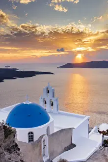 Places Of Worship Prints: A white church with blue dome overlooking the Aegean Sea at sunset