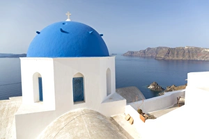 Cyclades Prints: White church with blue dome overlooking the Caldera