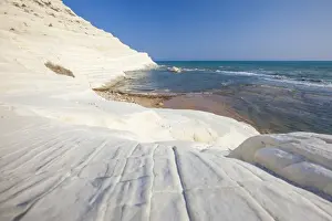 White cliffs known as Scala dei Turchi frame the turquoise sea, Porto Empedocle