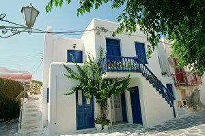 Cyclades Gallery: White house with blue doors and shutters on Mykonos