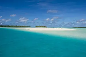 White sand beach and palm fringed beach in Aitutaki lagoon, Rarotonga and the Cook Islands