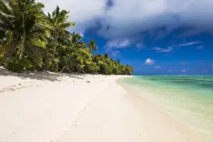 White sandy beach and palm trees on tropical Rarotonga Island, Cook Islands, South Pacific