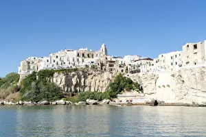 Apulia Prints: Whitewashed houses and San Francesco church on cliffs, Vieste, Foggia province
