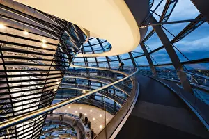 Parliament Building Prints: Wide angle interior view of The Dome of the Reichstag building at night, designed