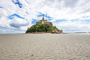 Opportunity Prints: Wide-angle view of Mont Saint-Michel isolated during low tide in France with sandy landscape