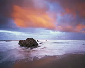 Images Dated 13th February 2008: Widemouth Bay at sunrise, with offshore rocks and red storm clouds overhead