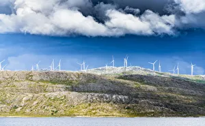 Wind Power Prints: Wind farm of white turbines on rocky coastline, Troms county, Norway, Scandinavia, Europe