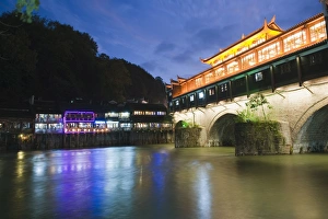 Illuminating Prints: Wind and rain bridge illuminated at night, Fenghuang, Hunan Province, China, Asia