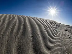Rippled Prints: Wind swept barkhan sand dunes on the barrier island of Isla Magdalena