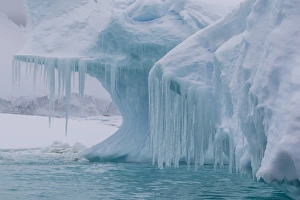 Booth Island Prints: Wind and water sculpted iceberg with icicles at Booth Island, Antarctica, Polar Regions