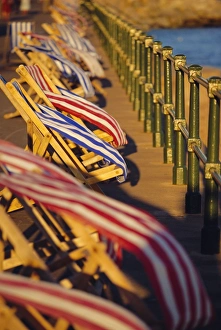 Windy Prints: Windblown deckchairs on seafront, Sidmouth, Devon, England