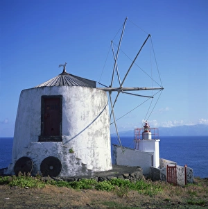 Flores Prints: Windmill on Corvo with the island of Flores in the background