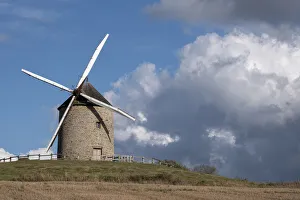 Windmills Prints: Windmill on top of a hill with a blue sky with white clouds, Normandy, France, Europe