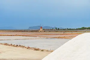 Trapani Province Prints: Windmill with pile of salt in the salt flats
