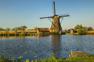 Windmill at sunset, Kinderdijk, UNESCO World Heritage Site, South Holland, Netherlands