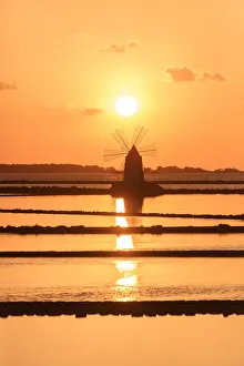 Windmill at sunset, Saline dello Stagnone, Marsala, province of Trapani, Sicily, Italy