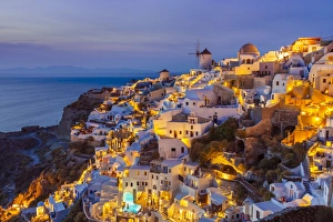 Domes Prints: Windmill and traditional houses after sunset