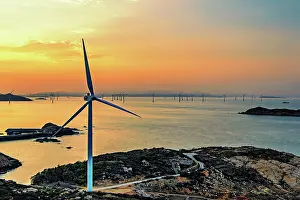 Sustainable Prints: Windmills in a golden sunset, Pingtan Island, Fuzhou City, Fujian Province, China