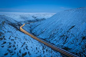 Tail Light Prints: Winter landscape and trail lights on Snake Pass, Peak District National Park, Derbyshire