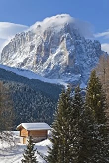 Images Dated 7th March 2009: Winter snow covered mountain hut in front of Sassolungo mountain, 3181m