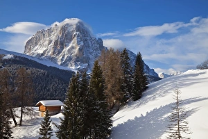 Images Dated 7th March 2009: Winter snow covered mountain hut in front of Sassongher mountain, 2665m