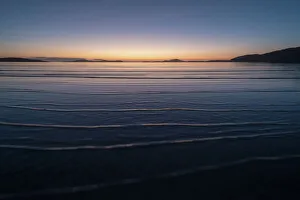 Rippled Gallery: Winter sunrise at high tide, Traigh Mhor, the beach used as Barra Airport at low tide