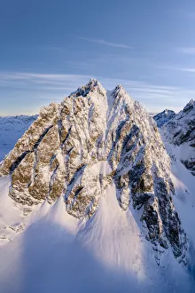 Valtellina Prints: Winter sunrise over the snowcapped Piz Roseg peak, aerial view, Valmalenco, Valtellina
