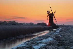 Winter sunrise over St. Benet's Mill near Thurne, Norfolk, England, United Kingdom, Europe