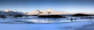 Images Dated 11th February 2009: Winter view at dawn over frozen Lochain Na h Achlaise to sun-kissed Black Mount hills