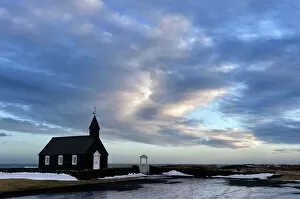 Landscapes Collection: Winter view at dusk of black wooden church at Budir, Snaefellsnes Peninsula, Iceland