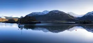 Loch Leven Prints: Winter view of flat calm Loch Leven with snow covered mountains reflected