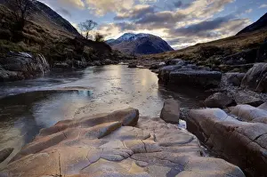 Winter view along partly-frozen River Etive towards distant mountains, Glen Etive