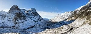 Winter view down snow-covered Glencoe showing Three Sisters of Glencoe