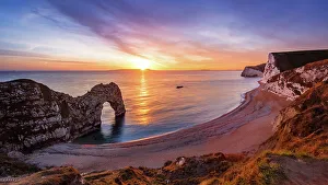 Natural Arch Prints: A winters sunset over Durdle Door on the Jurassic Coast, UNESCO World Heritage Site