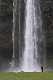 Images Dated 5th June 2009: Woman admiring the big waterfall of Seljandsfoss, Iceland, Polar Regions