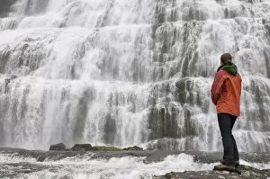 Images Dated 11th June 2009: Woman admiring Dynjandi waterfalls, Westfjords, Iceland, Polar Regions