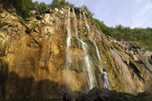 Images Dated 15th August 2008: Woman admiring the giant waterfall in the Plitvice Lakes National Park