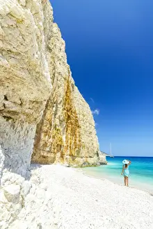 Mid Adults Prints: Woman admiring the white limestone cliffs standing on Fteri Beach