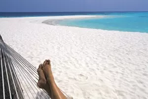Woman barefoot in hammock, Maldives, Indian Ocean, Asia