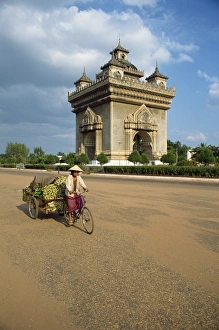 Trailer Prints: Woman on a bicycle with a trailer rides past the Anousavari